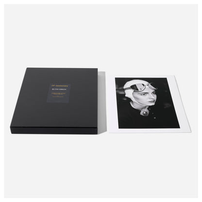 Black portfolio box with a photo of a woman wearing a helmet on a white background from Ruth Orkin's American Girl in Italy.